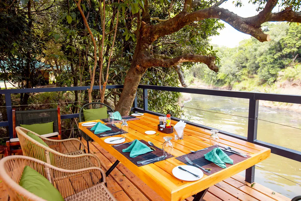 Outdoor dinning set up - A Day in the Life of a Guest at Serenity Mara Legends Camp