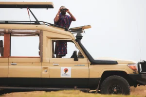 Safari Vehicle Maasai Driver Guide Amos Angle 4 Serenity Mara Legends Camp 1 1920x1280.jpg